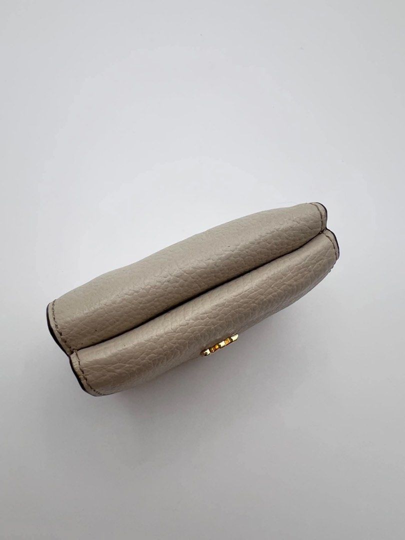 Authentic MK Compact trifold wallet in ivory color. (Category: Wallets & Card holders) located in Cagayan de Oro. Submitted by borse_de_amore (Listing ID 1466424628, Image 3). Description: Authentic MK Compact trifold wallet in ivory color. Rank A pa only flaws is pressmarks. Very cute can fit in small bags 🏷️1,580.