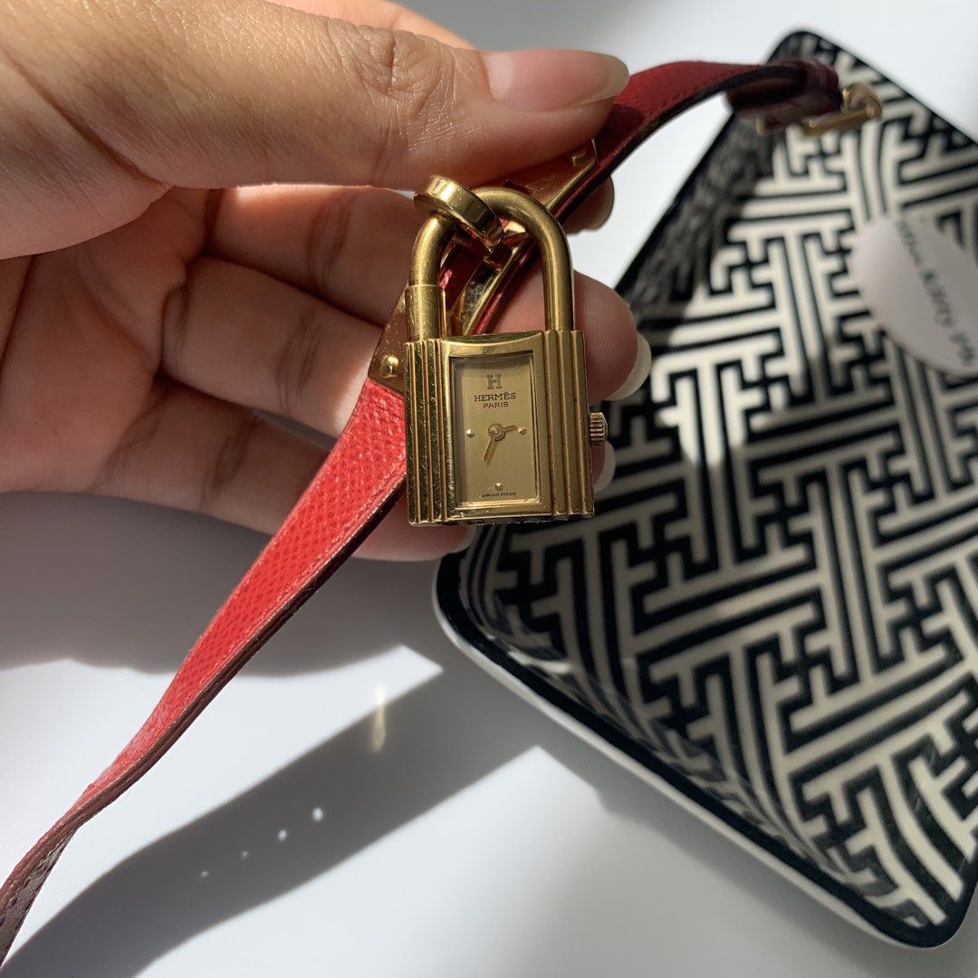 Authentic preloved Hermes Kelly Red watch (Category: Luxury Watches) located in San Pablo. Submitted by misskittyph (Listing ID 1466386775, Image 3). Description: Hermes Kelly ladies watch ▪️41.5k . quartz movement gold color dial; red leather bracelet fits S-L Comes with pouch 8.9/10 condition Stamp Y ⭕️ Layaway options available 💯Guaranteed authentic or your money back Contact number linked in bio.