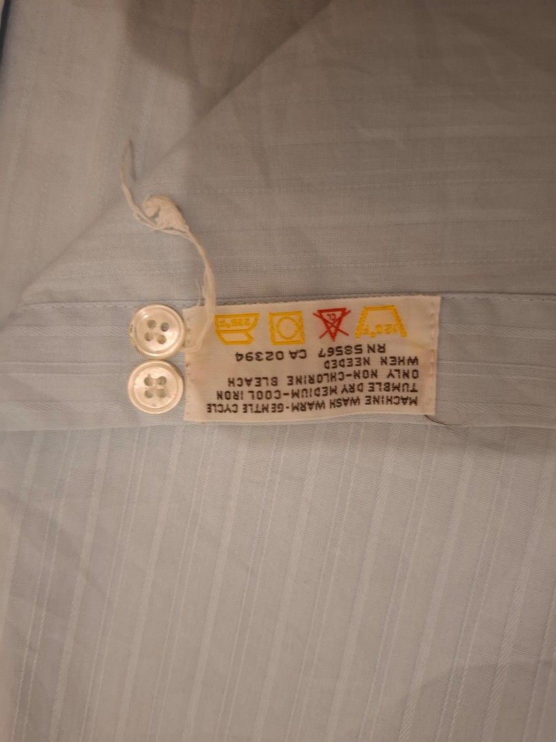 Authentic Vintage Yves Saint Laurent (Category: Formal Shirts) located in Calamba. Submitted by mrq.io (Listing ID 1466396872, Image 3). Description: Size: S-M Condition: 7/10 Dimensions : L 30 x W 19 Clean vintage piece. Stains on neck collar and hand cuffs. No major flaws. 📦 Shipping available nationwide 📍 Calamba, Laguna.