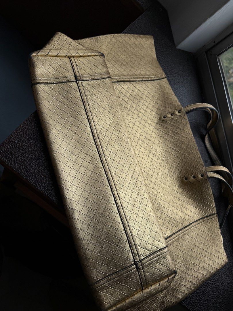B (Category: Announcements) located in Kuala Lumpur. Submitted by ysy0889 (Listing ID 1466429849, Image 3). Description: This is a golden‑yellow Bottega Veneta tote bag. There are signs of wear on the corners from personal use. It is a limited‑edition piece, and it is hard to find this item nowadays..