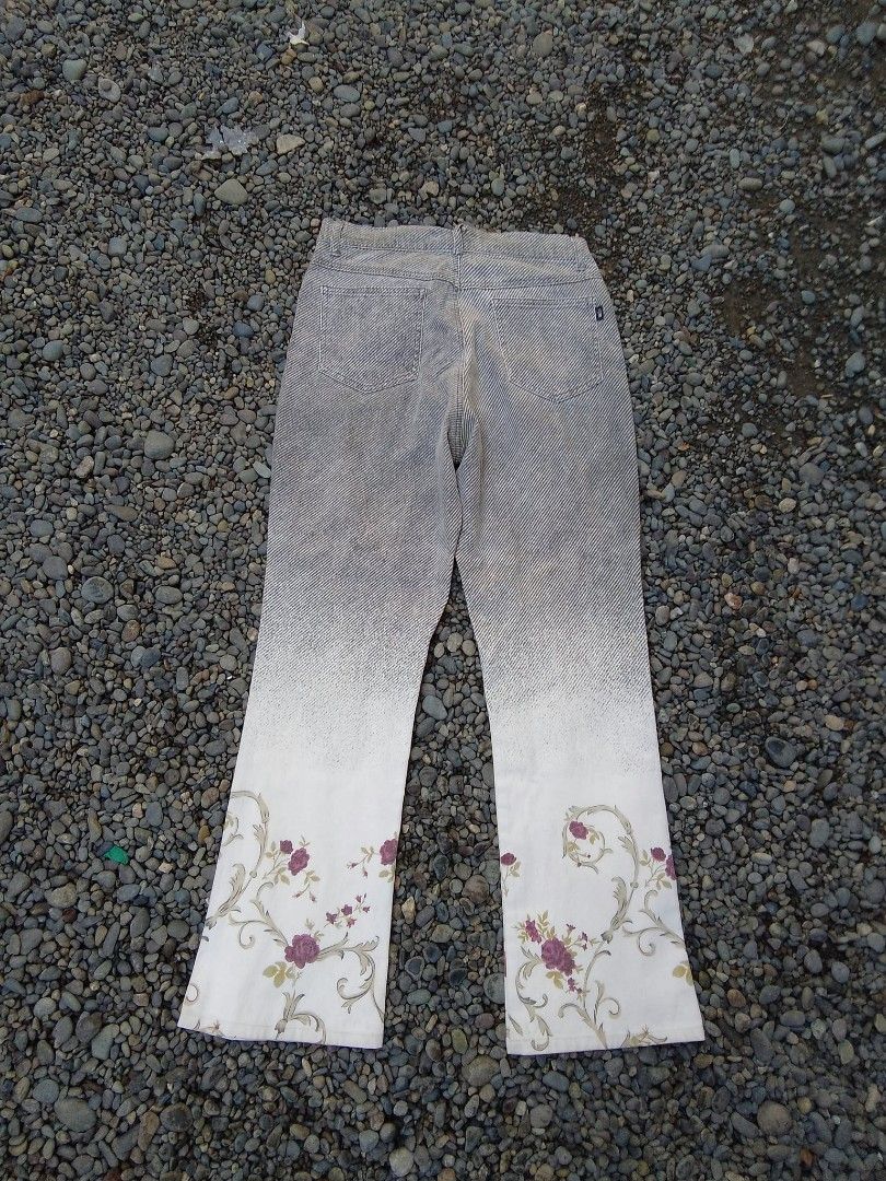 Back & Forth Grey Striped Floral Hem Denim Jeans (Category: Jeans) located in Manila. Submitted by trifted.lootsph (Listing ID 1466461317, Image 2). Description: - Brand: Back & Forth - Design: Grey and white stripe pattern with a gradient fade and white hem featuring a rose floral print - Details: Button closure with metal hardware, zip fly, and back patch pockets - Size: Tagged size 64 - Material: 95% cotton, 5% polyurethane - Condition: Excell
