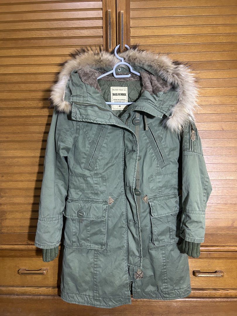 Back Number Military Troop Parka Jacket Size M (Category: Coats, Jackets and Outerwear) located in Manila. Submitted by quincy.67 (Listing ID 1466450829, Image 1). Description: - Brand/Model: Back Number military troop parka - Color: Olive green - Size: Medium - Material: Heavy cotton shell with warm fleece hood lining - Closure: Chunky zip with button storm flap - Features: Faux fur-trimmed hood, sleeve and front utility pockets, ribbed inner cu