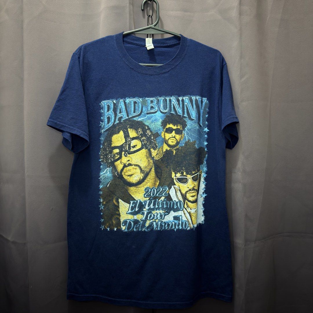 BAD BUNNY (no side stitch) (Category: Tshirts & Polo Shirts ) located in Manila. Submitted by craffee00 (Listing ID 1466348094, Image 1). Description: 🐰⚡ VINTAGE STYLE BAD BUNNY 2022 TOUR TEE ⚡🐰 Rep one of the biggest artists in the world with this Bad Bunny “El Último Tour Del Mundo” 2022 concert shirt! • Front: Vibrant graphic featuring Bad Bunny with tour branding. • Back: Sick skull graphic with full 2022 North American tour dates list. • C