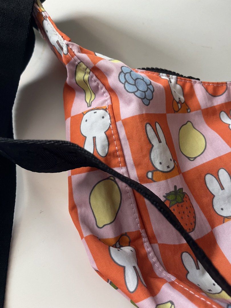 Baggu x Miffy Medium Nylon Crescent Bag Checkered Fruit (Category: Shoulder Bags) located in Cainta. Submitted by nitro_ups (Listing ID 1466411636, Image 2). Description: - Unused & Authentic Baggu Medium Nylon Crescent Bag - Rare Checkered Fruit Miffy print (Pink & Orange with Miffy and assorted fruits) - Brand new with tag attached - Made of durable, heavyweight recycled nylon - Comfortable black strap with Baggu branding .