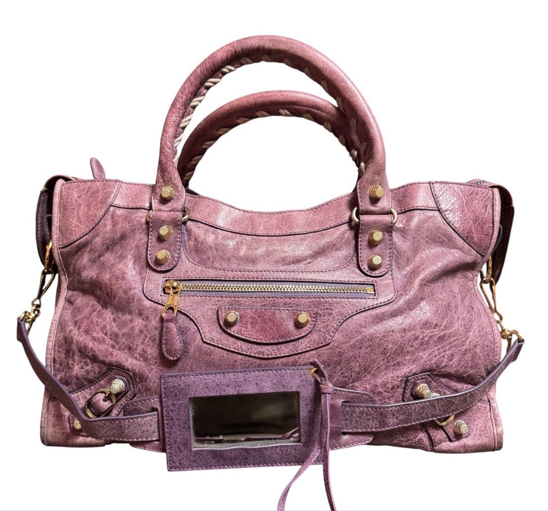 Balenciaga Motorcycle Shoulder Bag (Category: Shoulder Bags) located in Baguio. Submitted by pwz-eshop (Listing ID 1466392991, Image 1). Description: • Up for Grabs!! • Flaws: Rubs on corners, scratches on leather, handles a bit dark underneath. (please see photos) • BRAND: BaIen ciaga. • DIMENSIONS: length 14.75", height 9", width 5", handle drop: 5"-10". • SERIAL NUMBER: 115748-3444. • COUNTRY OF ORIGIN: ITALY. • MATERIAL: Leather. • COLOR: Lil