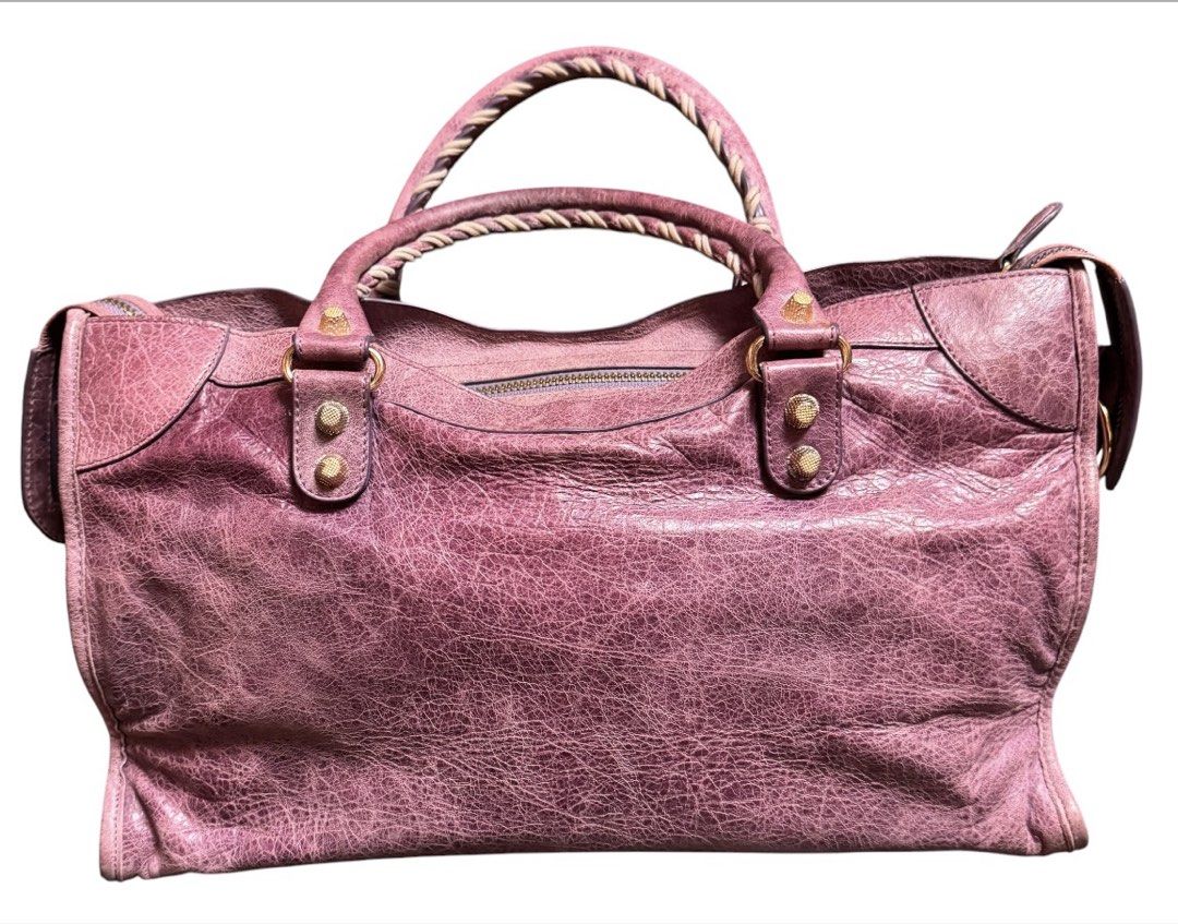 Balenciaga Motorcycle Shoulder Bag (Category: Shoulder Bags) located in Baguio. Submitted by pwz-eshop (Listing ID 1466392991, Image 2). Description: • Up for Grabs!! • Flaws: Rubs on corners, scratches on leather, handles a bit dark underneath. (please see photos) • BRAND: BaIen ciaga. • DIMENSIONS: length 14.75", height 9", width 5", handle drop: 5"-10". • SERIAL NUMBER: 115748-3444. • COUNTRY OF ORIGIN: ITALY. • MATERIAL: Leather. • COLOR: Lil