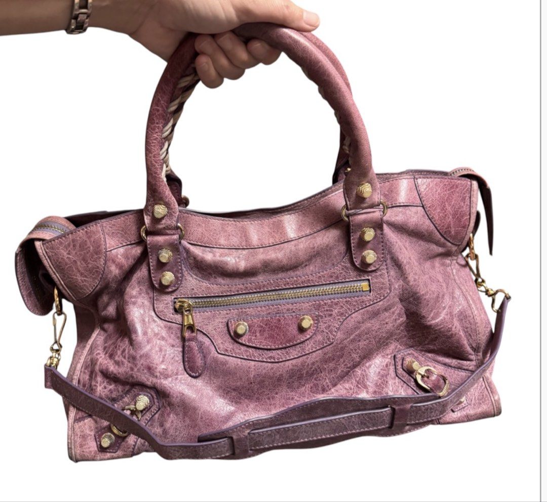 Balenciaga Motorcycle Shoulder Bag (Category: Shoulder Bags) located in Baguio. Submitted by pwz-eshop (Listing ID 1466392991, Image 3). Description: • Up for Grabs!! • Flaws: Rubs on corners, scratches on leather, handles a bit dark underneath. (please see photos) • BRAND: BaIen ciaga. • DIMENSIONS: length 14.75", height 9", width 5", handle drop: 5"-10". • SERIAL NUMBER: 115748-3444. • COUNTRY OF ORIGIN: ITALY. • MATERIAL: Leather. • COLOR: Lil