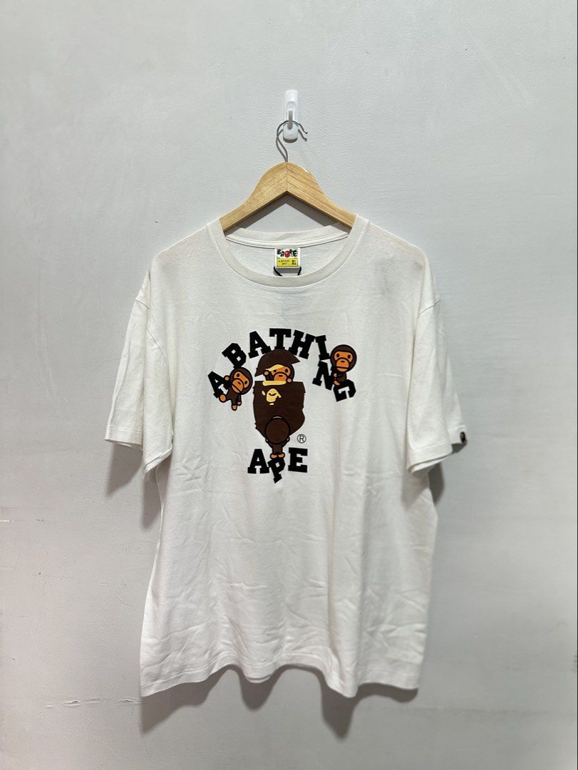BAPE Baby Milo A Bathing Ape Graphic Tee White (Authentic) (Category: Tshirts & Polo Shirts ) located in Manila. Submitted by ylsrarities (Listing ID 1466545227, Image 1). Description: Details: • Brand: A Bathing Ape / BAPE • Size: XL • Color: White • Graphic: Baby Milo / Bathing Ape • Measurements: 22Wx29L • NOWHERE CO., LTD. neck label • Original BAPE sleeve Ape tag Condition: 9/10 Good condition with normal signs of age and wear. Please review