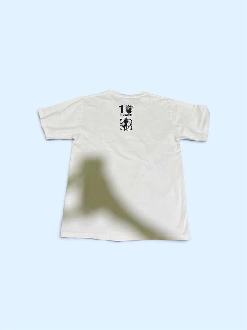 BAPE x Kid Cudi College Moon Tee (Category: Tshirts & Polo Shirts ) located in San Juan City. Submitted by thrifttolife (Listing ID 1466480058, Image 2). Description: - Item: BAPE NY Store 10th Anniversary White T-Shirt - Design: Blue camo graphic print on chest with small logo hit on upper back - Material: 100% soft cotton, comfortable feel - Fit: Standard crew neck, short sleeves - Condition: Excellent / Pre-loved (Please check photos) - Authen
