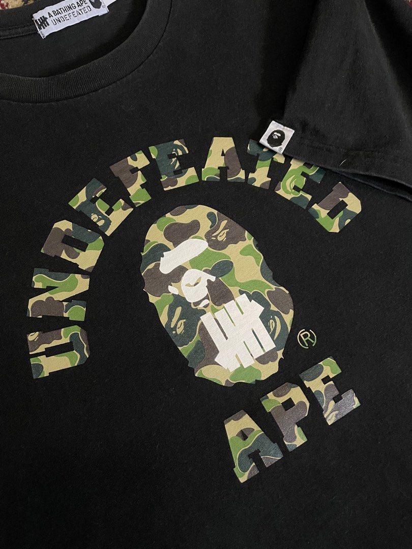 Bape x Undefeated ABC Green Camo (Category: Tshirts & Polo Shirts ) located in Manila. Submitted by kabloh (Listing ID 1466436189, Image 2). Description: Gently used | Very good condition Large 21x29 Signs of usage Color rate: 9/10 Authentic Not thrifted Slightly nego.