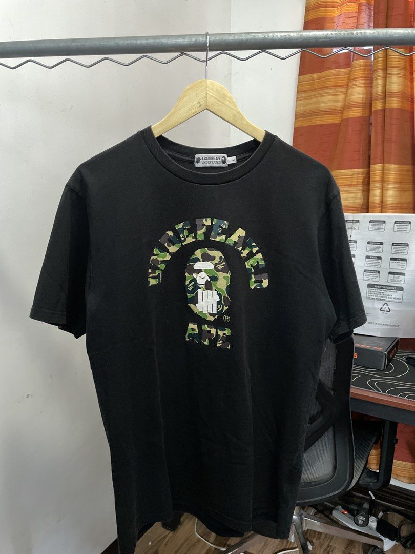Bape x Undefeated ABC Green Camo (Category: Tshirts & Polo Shirts ) located in Manila. Submitted by kabloh (Listing ID 1466436189, Image 1). Description: Gently used | Very good condition Large 21x29 Signs of usage Color rate: 9/10 Authentic Not thrifted Slightly nego.