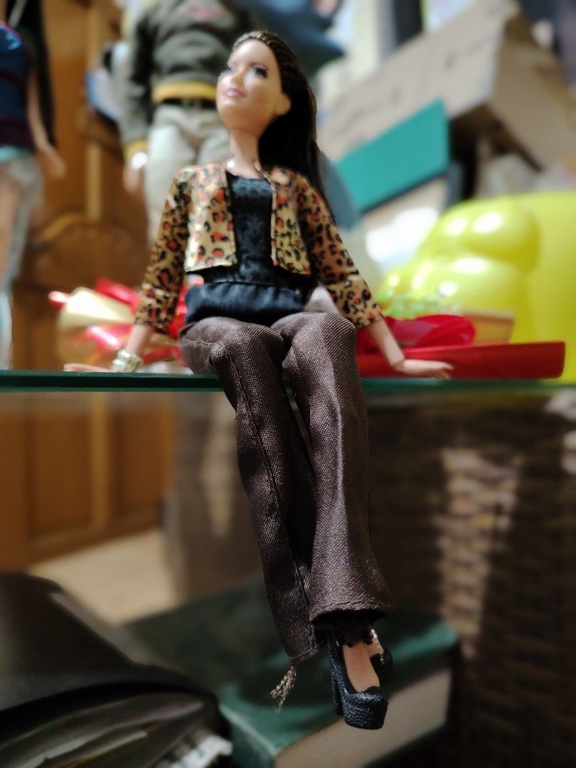 Barbie doll with leopard print jacket and black top (Category: Figurines & Statues) located in Manila. Submitted by justybelieve2026 (Listing ID 1466562413, Image 3). Description: - Barbie fashion doll in stylish outfit with eye lashes - Leopard print jacket over a black textured top - Brown satin trousers and black high heel shoes - Styled with long dark hair - Comes with a metallic bracelet accessory.