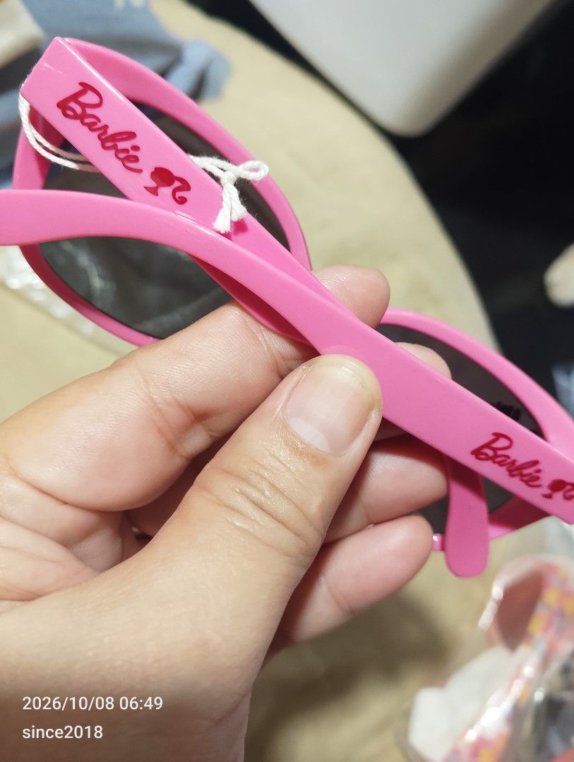 Barbie Pink Polka Dot Sunglasses Mattel 2017 (Category: Sunglasses & Eyewear) located in Quezon City. Submitted by sellingwithlove2018 (Listing ID 1466561920, Image 3). Description: - Authentic Barbie collectible sunglasses - Bright pink frames with playful white polka dots - Dark tinted lenses with white Barbie logo on the corner - Inner temples feature Mattel 2017 copyright and style code 2331-03 - Perfect fun accessory for fans and collectors 
