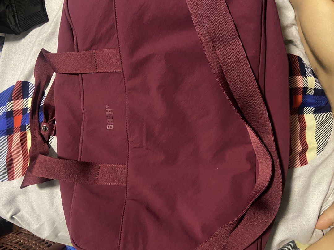 BASH Expedition Weekender Mono in Jet Set (Limited Edition) (Category: Sling Bags) located in Quezon City. Submitted by angelshopssells (Listing ID 1466461543, Image 2). Description: Used twice, bought for ₱2900 at Tiktok Shop All zipper covers still on With the small pouch Complete with original packaging and dust bag RFS: gifted another bag for travel BASH - Color: Maroon - Material: Smooth, durable fabric with branded pull tabs - Compartments: