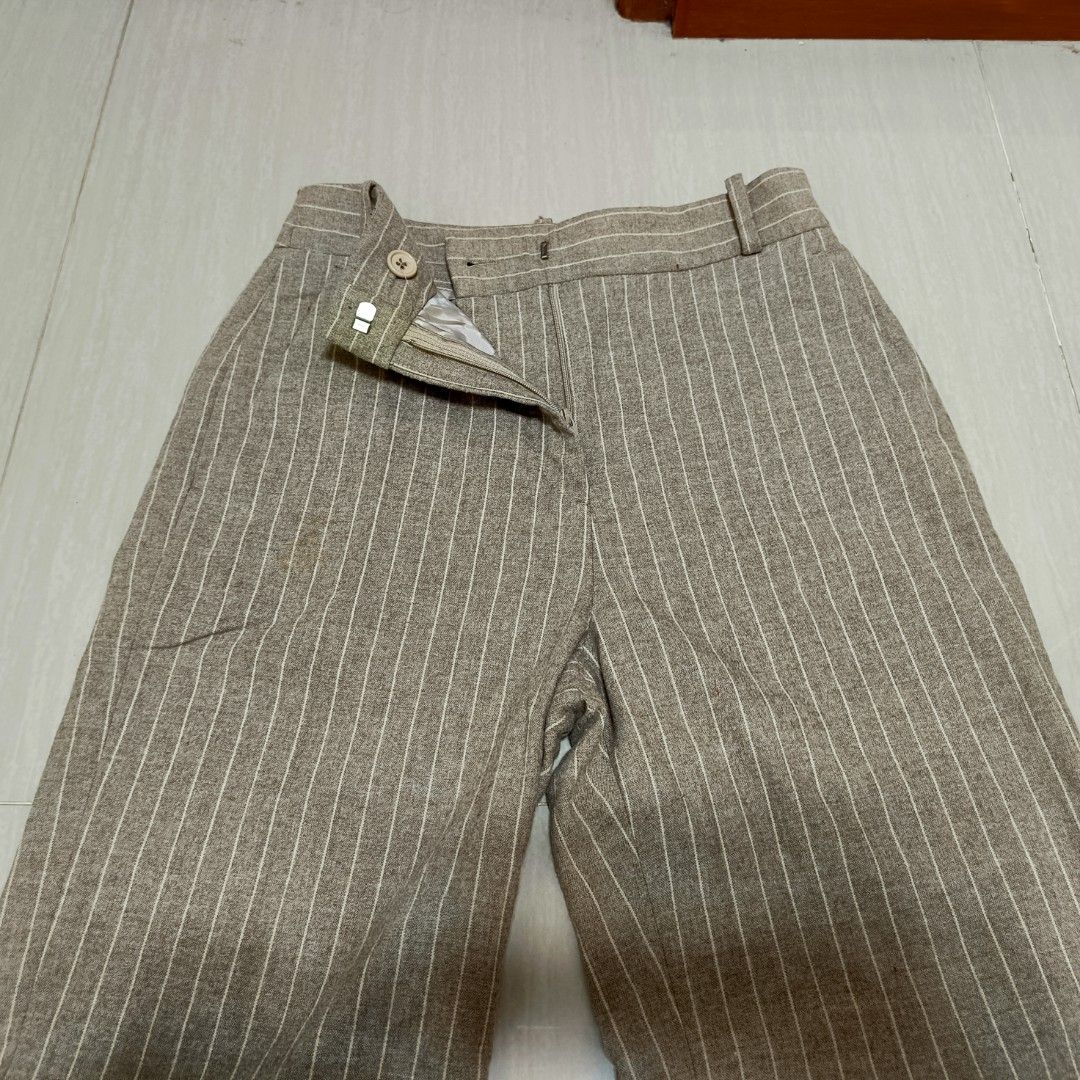 ba&sh Tamo Pants Wool Trousers Size 0 (Category: Trousers) located in Nasugbu. Submitted by staffpicks1515 (Listing ID 1466401088, Image 3). Description: Ba&sh Tamo pants in brown with white pinstripes. Wool blend material. Tailored fit with belt loops, front zip closure with button, two side pockets, and two back pockets. Made in Bulgaria. Size 0. Waist measures 26 inches, outseam 41 inches, inseam 30 inches, hips 19 inches, rise 13.5 inches, th