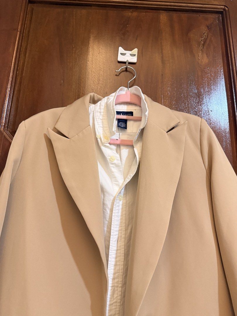 Beige Double Breasted Blazer Jacket (Category: Coats, Jackets and Outerwear) located in Mandaluyong City. Submitted by riz_040521 (Listing ID 1466471008, Image 2). Description: - Color: Versatile beige - Style: Double-breasted button front with notched lapels - Details: Structured shoulders, two front pocket flaps, and back vent hem - Fabric: Clean, solid fabric throughout - Ideal for: Office wear, smart casual outfits, and layering.