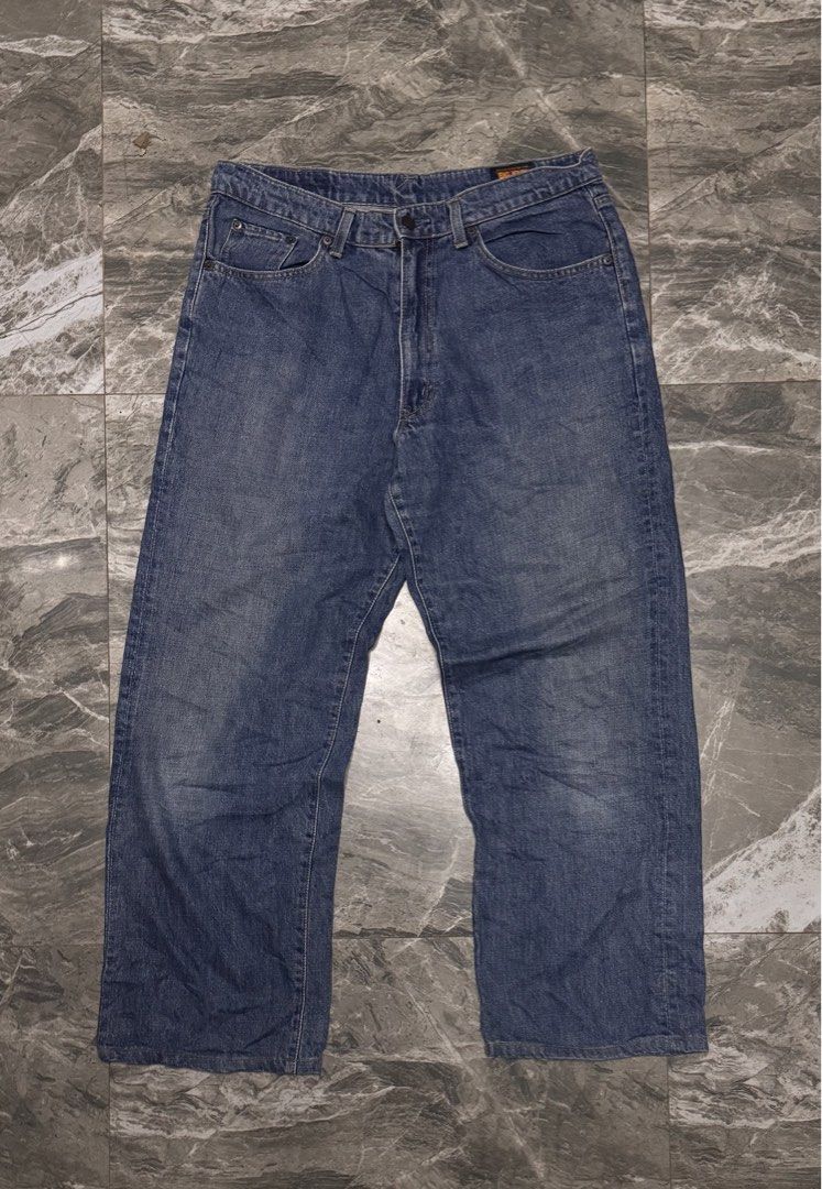 Big John Universal Blue Denim Jeans (Category: Jeans) located in Alaminos. Submitted by outfitcheck.ph (Listing ID 1466472081, Image 1). Description: - Brand/Model: Vintage Big John Universal Denim Jeans - Wash: Medium blue with natural fading - Fit: Straight fit leg silhouette - Style: Classic five-pocket styling - Details: Leather brand patch, red woven tab on rear pocket, and inner waistband label with yellow lettering - Material: Sturdy, dura