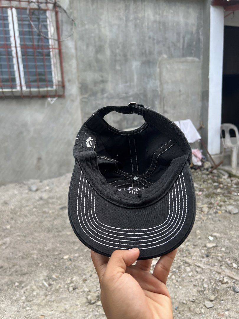 Billabong Black Cap with White Contrast Stitching (Category: Caps & Hats) located in Iba. Submitted by saploot (Listing ID 1466478946, Image 3). Description: - Brand: Billabong - Color: Classic black with contrasting white stitching on brim, seams, and front logo - Closure: Adjustable metal buckle strap with branded tag - Condition: Clean interior sweatband and lining, excellent overall condition - Style: Versatile everyday cap that matches any o