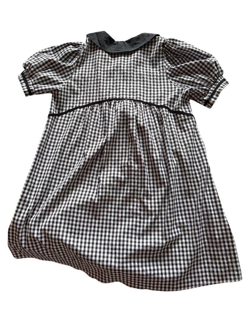 Black and White Gingham Dress with Peter Pan Collar (Category: Dresses) located in Mandaluyong City. Submitted by katsulist (Listing ID 1466430033, Image 3). Description: Black and white gingham babydoll dress with puff sleeves, button-down front. Flowy and loose, comfortable fit. Only issue is loose threads. Width: Up to 23 inches Length: 36 inches Arm hole: 5.5 inches.