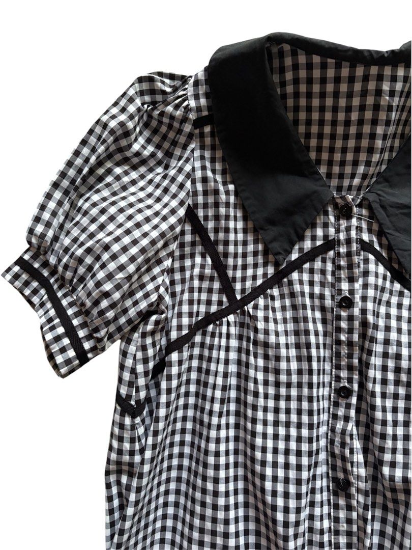Black and White Gingham Dress with Peter Pan Collar (Category: Dresses) located in Mandaluyong City. Submitted by katsulist (Listing ID 1466430033, Image 2). Description: Black and white gingham babydoll dress with puff sleeves, button-down front. Flowy and loose, comfortable fit. Only issue is loose threads. Width: Up to 23 inches Length: 36 inches Arm hole: 5.5 inches.