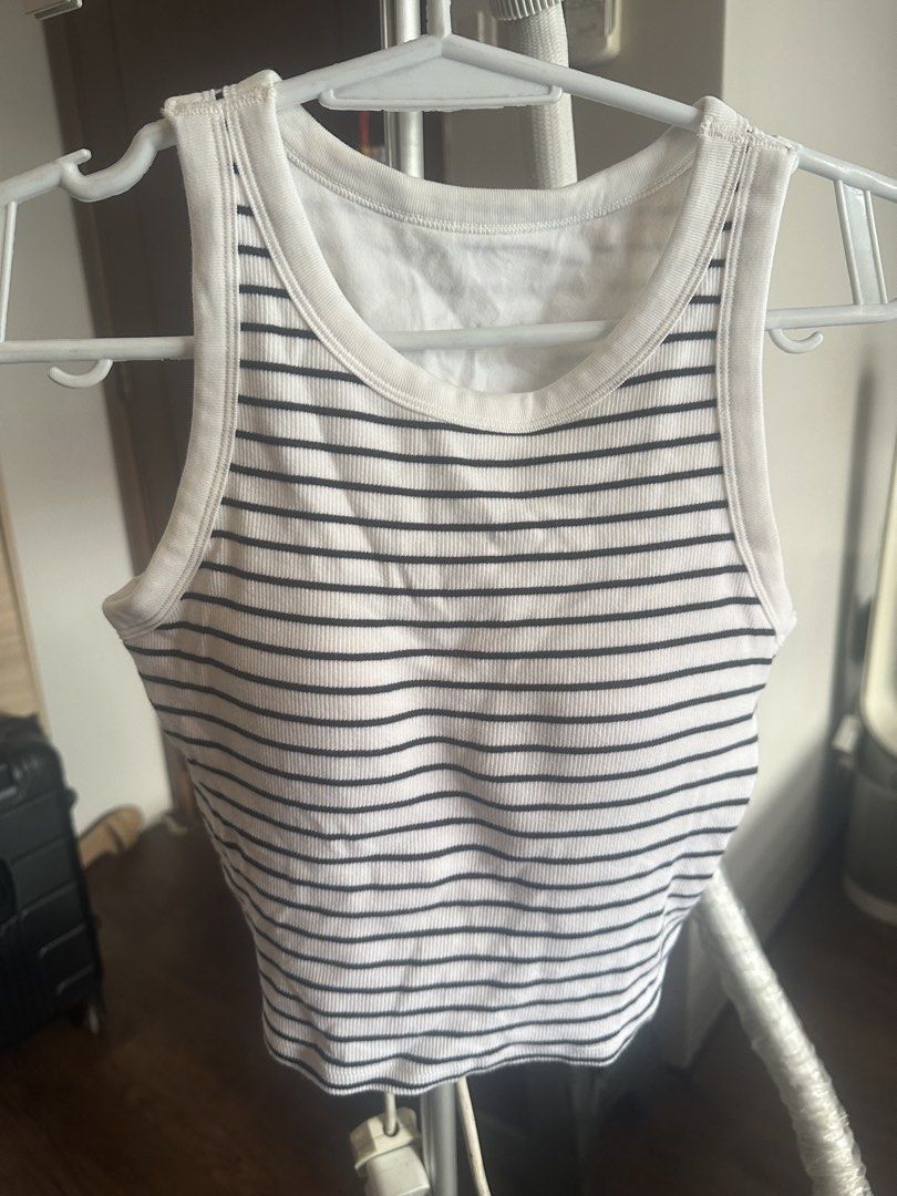Black and White Striped Ribbed Tank Top (Category: Sleeveless) located in Makati City. Submitted by alyssa1718 (Listing ID 1466393485, Image 1). Description: - Black and white striped ribbed tank top - Scoop neckline with thick binding - Fitted, stretchy cotton material - Cropped length - Great basic piece for warm weather - Clean condition.