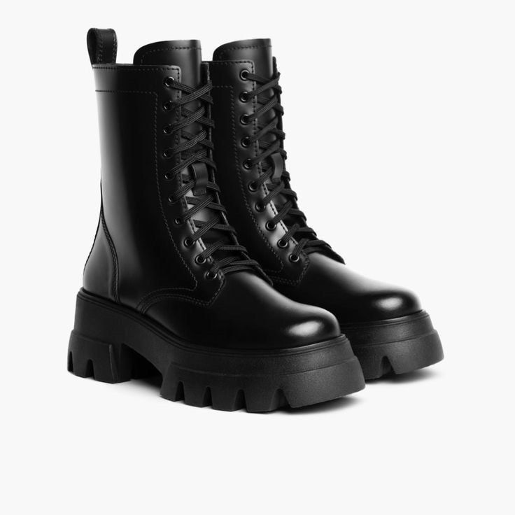 Black Combat Chunky Boots (Category: Boots) located in Imus. Submitted by httpnrl (Listing ID 1466489015, Image 1). Description: Can negotiate price🥰 - Color: Classic black - Material: Smooth synthetic leather - Design: Lace-up front with metal eyelets and back pull loop - Sole: Thick lug sole with a chunky platform heel - Height: Mid-calf shaft - Styling: Perfect to pair with jeans, skirts, or dresses for daily wear.