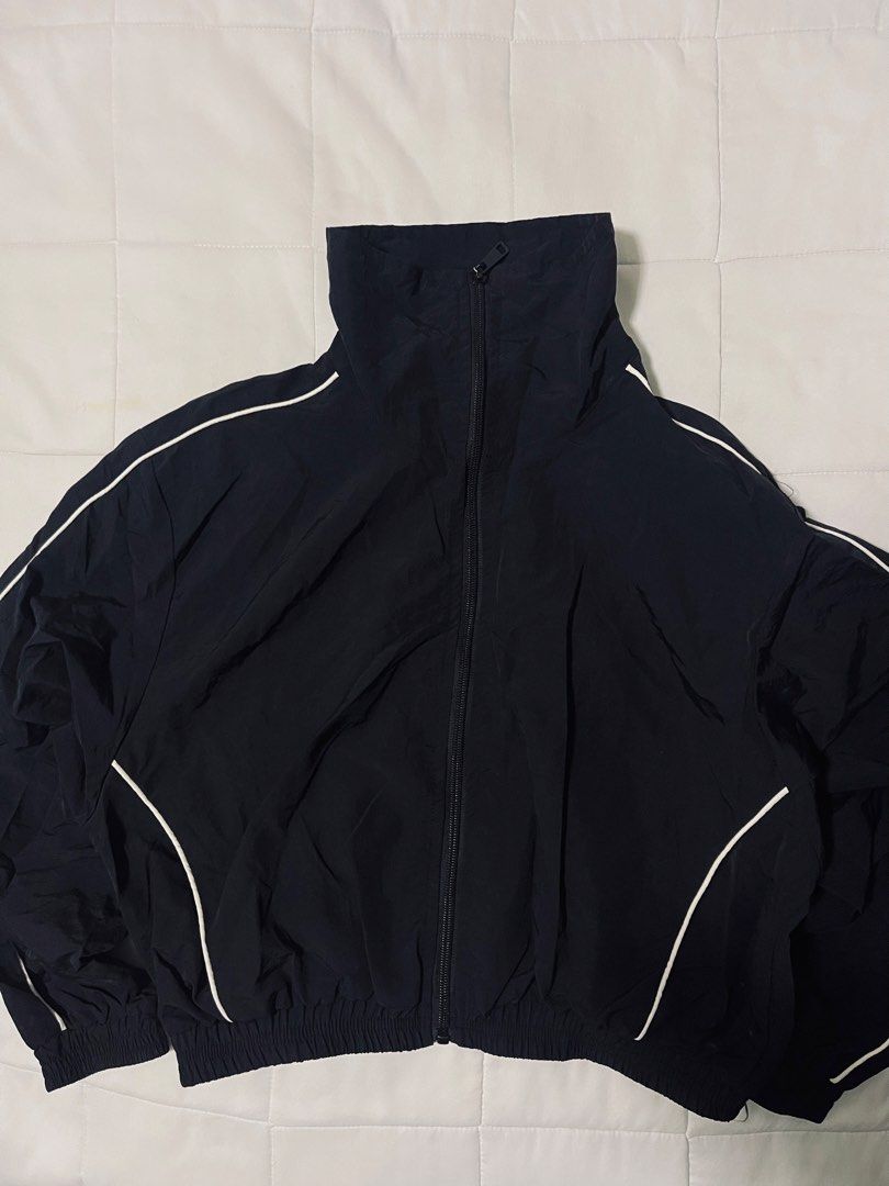 Black Nylon Zip-Up Windbreaker Jacket (Size S) (Category: Activewear) located in Davao. Submitted by curatedcloset.dvo (Listing ID 1466476517, Image 2). Description: • Brand: No Brand but looks and feels exactly like the H&Ms Jacket Windbreaker Nylon • Original Price: ₱800 • Size: Small (S) on tag • Material: 100% Nylon Polyamide Shell / Polyester Lining on tag • Color: Classic Black with White piping accents • Condition: 10/10 excellent conditio
