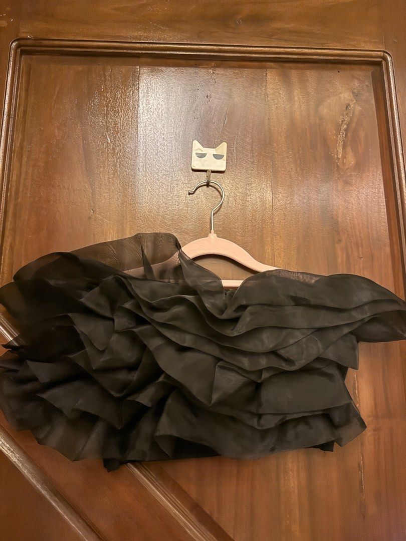 Black tube top with dramatic ruffle overlay (Category: Sleeveless) located in Mandaluyong City. Submitted by riz_040521 (Listing ID 1466468551, Image 2). Description: - Color: Black - Style: Strapless crop top with a sheer ruffle overlay - Fit: Stretchy ribbed band, fits standard Small to Medium frames - Occasion: Perfect for nights out and parties - Condition: Worn a couple of times, still in great shape.