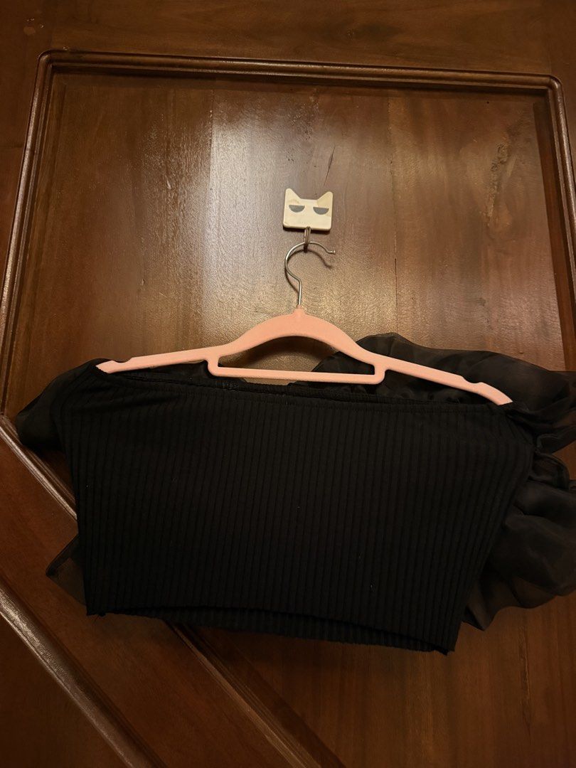 Black tube top with dramatic ruffle overlay (Category: Sleeveless) located in Mandaluyong City. Submitted by riz_040521 (Listing ID 1466468551, Image 1). Description: - Color: Black - Style: Strapless crop top with a sheer ruffle overlay - Fit: Stretchy ribbed band, fits standard Small to Medium frames - Occasion: Perfect for nights out and parties - Condition: Worn a couple of times, still in great shape.