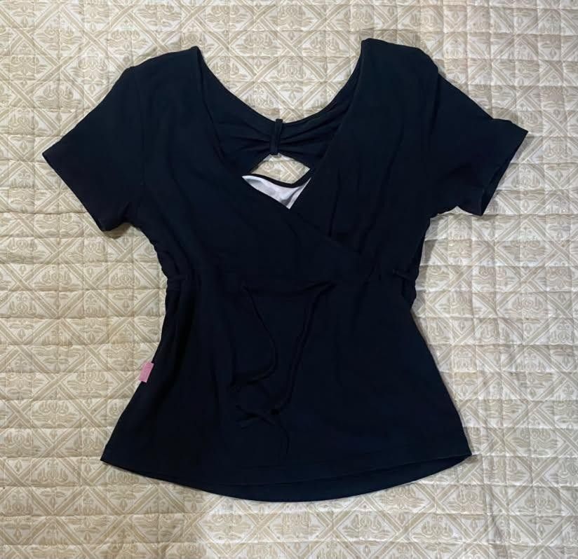 Black Wrap Front Top with Tie Waist (Category: Blouses) located in Pagadian. Submitted by kahtlopez47867 (Listing ID 1466477280, Image 2). Description: - Color: Dark navy / Black - Style: Wrap front with adjustable side tie strings & back cutout detail - Sleeves: Short sleeve - Material: 97% Rayon, 3% Spandex (super soft & stretchy) - Condition: Excellent / Great basic piece - Styling: Easy to pair with denim or skirts - Mode of Payment: GCash, B