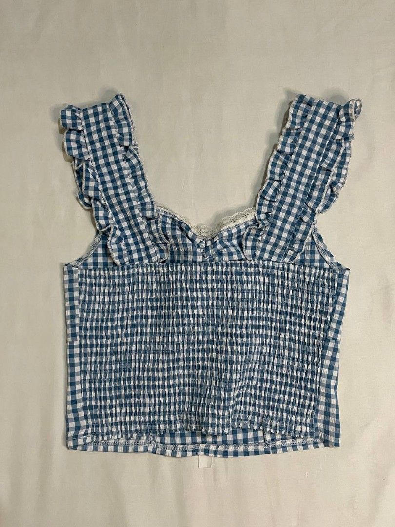Blue and White Gingham Ruffle Crop Top (Category: Sleeveless) located in Binan City. Submitted by declutterbyjwy (Listing ID 1466446476, Image 3). Description: - can fit xs-s - good as new, used once - Last price posted!.