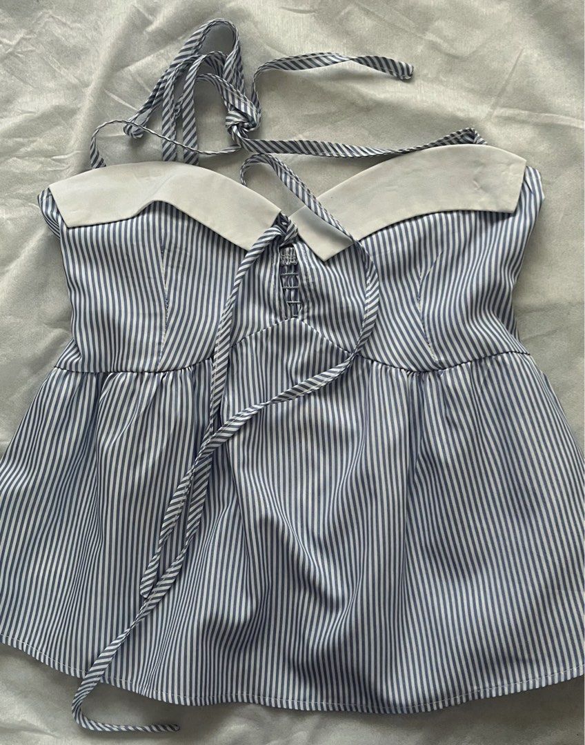 blue and white striped halter top (Category: Sleeveless) located in Manila. Submitted by aurevin (Listing ID 1466362519, Image 1). Description: 📌 size: xs-s 📌 condition: worn once only 📍 Metro Manila 💳 MOP: Gcash / Bank Transfer 📦 MOD: Lalamove / JNT / SDD / GGX / Grab delivery.