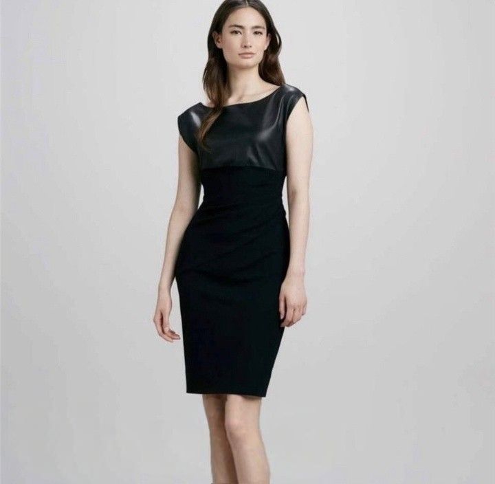 Blue Deep sheath silhouette black dress (Category: Dresses) located in Cabanatuan. Submitted by miss.maia (Listing ID 1466551121, Image 1). Description: This dress features a sheath silhouette combining a structured fabric with a distinctive, high-shine leather or coated-textile overlay panel across the top bodice..