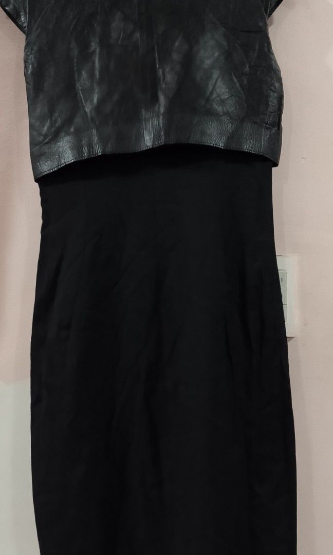 Blue Deep sheath silhouette black dress (Category: Dresses) located in Cabanatuan. Submitted by miss.maia (Listing ID 1466551121, Image 2). Description: This dress features a sheath silhouette combining a structured fabric with a distinctive, high-shine leather or coated-textile overlay panel across the top bodice..