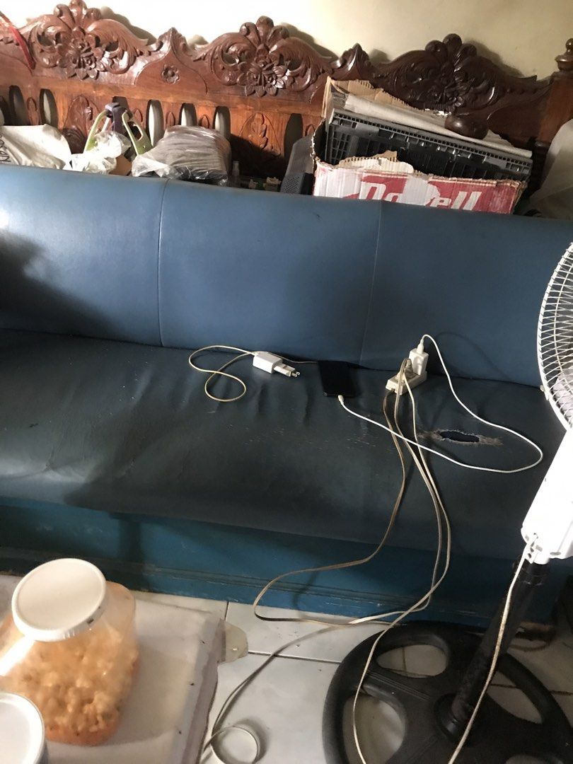 Blue leatherette bench sofa (Category: Sofas) located in Pasig City. Submitted by papotzy (Listing ID 1466393417, Image 1). Description: - Item: Blue leatherette bench sofa with 3 backrest sections - Build: Sturdy, solid construction underneath - Condition: Good overall, but has a visible tear on the right seating area - Ideal use: Perfect as extra seating for a bedroom, study, or workspace - Send a message for more details or to arrange pickup.