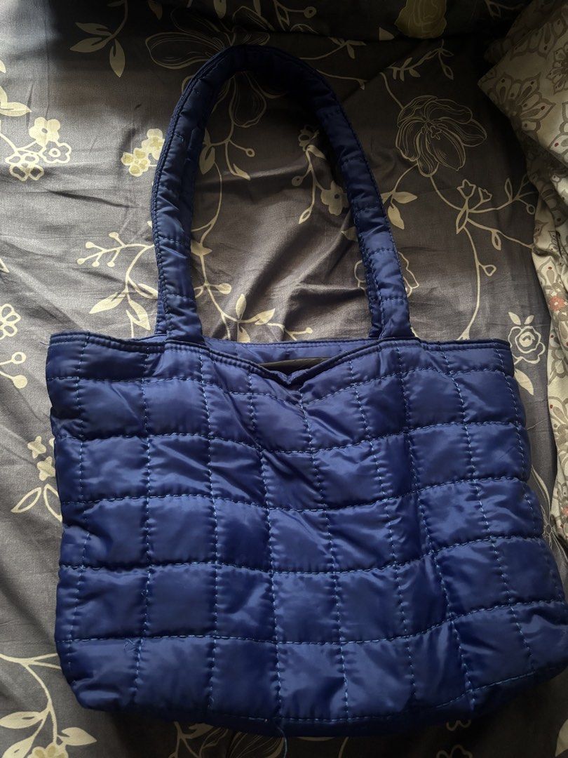 Blue Quilted Puffer Tote Bag (Category: Tote Bags) located in Manila. Submitted by yas__ (Listing ID 1466436761, Image 1). Description: - Blue tote bag - H&M Beige backpack - thrifted ysl shoulder bag - H&M furry black shoulder bag 200 each.