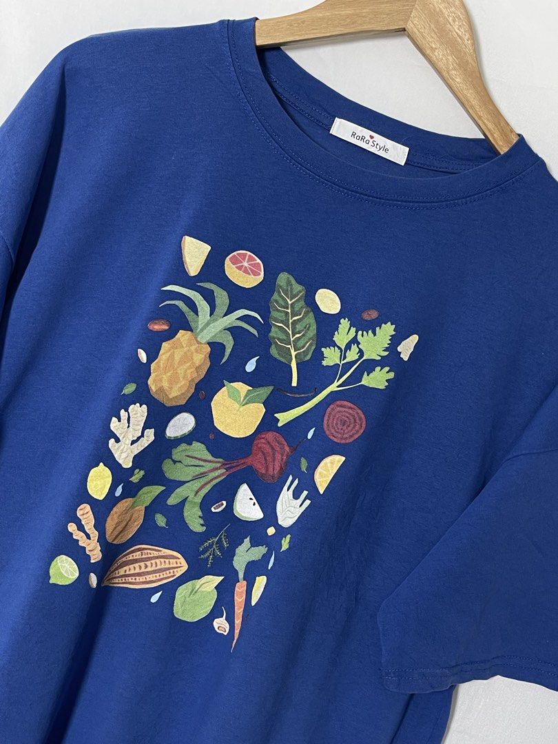 Blue Vegetable Art Graphic Shirt (Category: Tshirts & Polo Shirts ) located in Imus. Submitted by mochi.rella (Listing ID 1466508104, Image 3). Description: Blue Veg Good Condition | Slightly Faded Fit L W 23 | L 26 .
