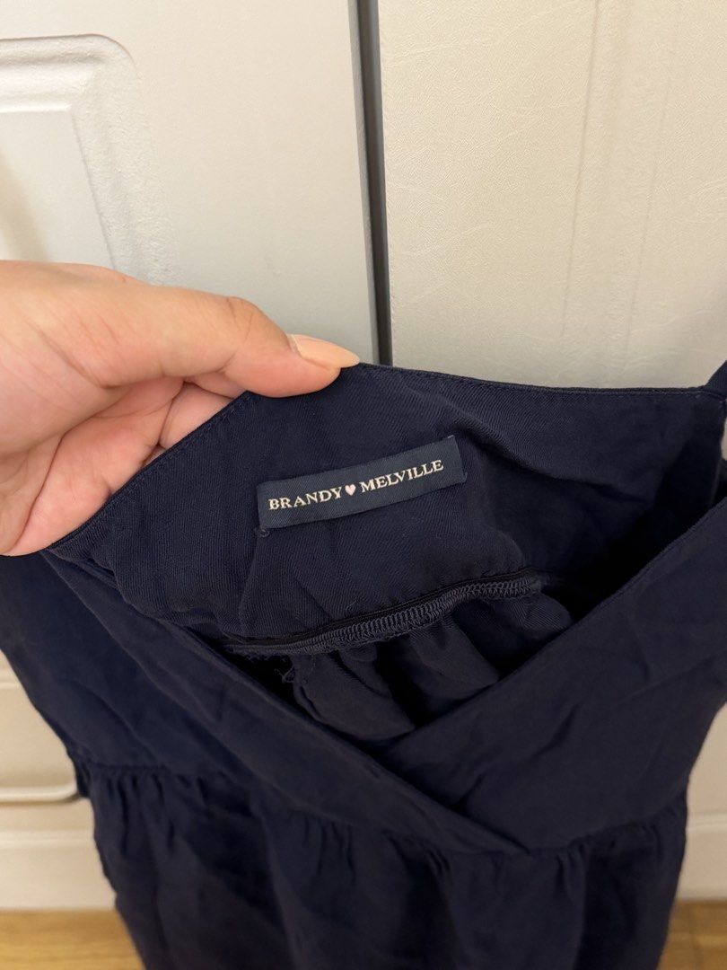 Brandy Melville Navy Blue Edith Tank (Category: Sleeveless) located in Pasay City. Submitted by erickaolalu (Listing ID 1466414914, Image 3). Description: 🏷️ bought from the US for ₱2,150 (Free size XS - S) too small for me 🥹 - Brand: Brandy Melville - Style: Edith Tank Top - Color: Dark Navy Blue - Details: Adjustable spaghetti straps, crossover v-neckline, gathered empire waist, lightweight flowy fit - Condition: Worn once just to fit. - Styl