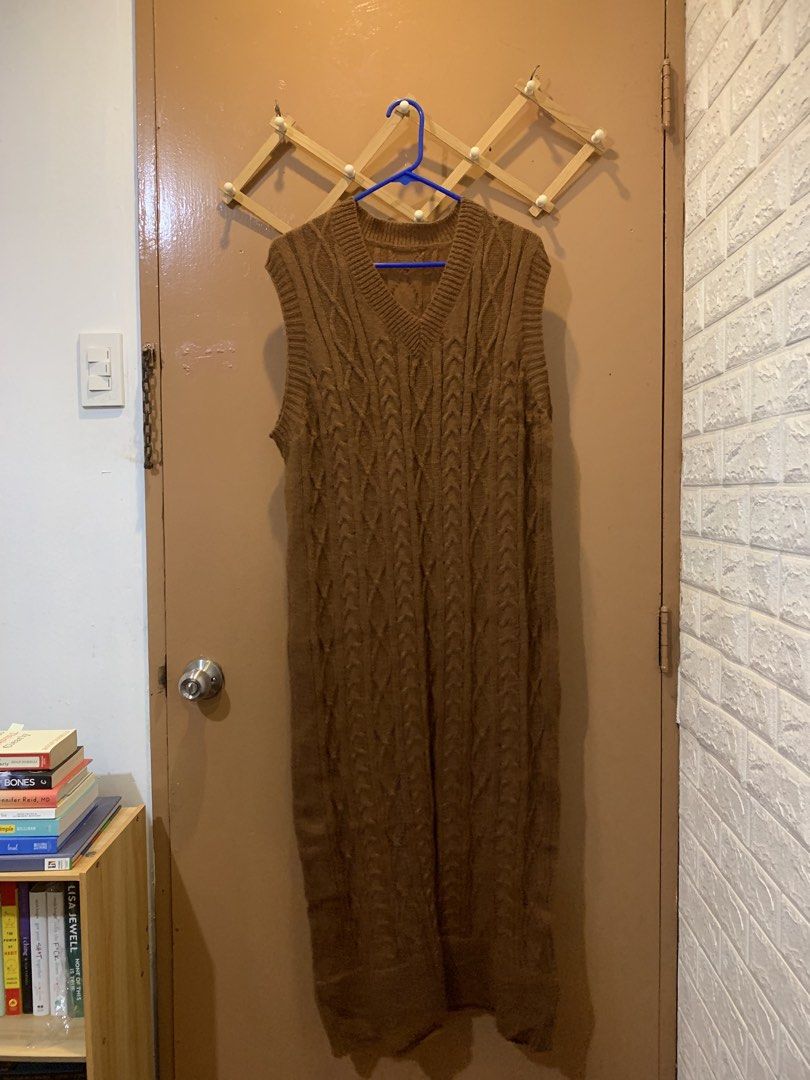 Brown Knit Long Dress (Category: Sleeveless) located in Las Pinas. Submitted by mscandicestarry (Listing ID 1466466408, Image 2). Description: - Color: Warm brown - Style: Cable knit sweater vest dress with V-neck - Fit: Full-length, straight fit with ribbed collar and armholes - Material: Cozy, soft knit - Perfect for: Autumn layering over shirts and pairing with boots - Condition: Excellent (Ready to ship!).