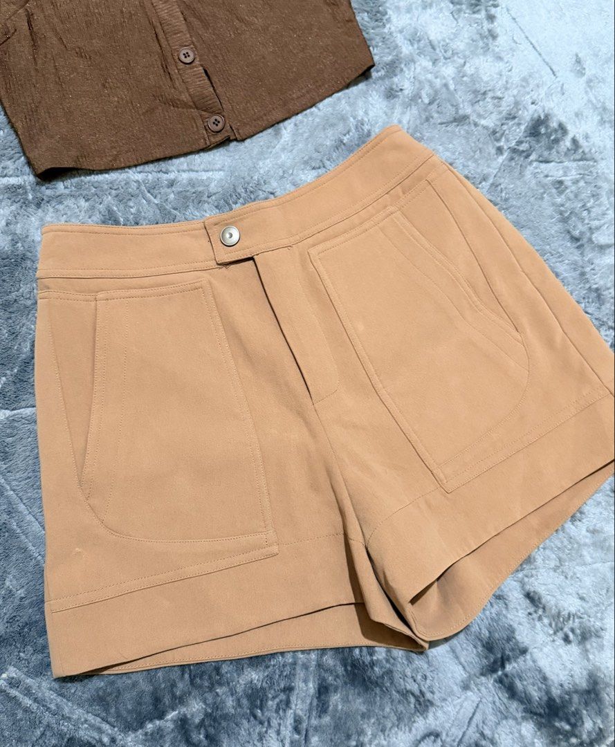 Brown Sleeveless Collared Top and Tan Shorts Set (Category: Sets or Coordinates) located in Manila. Submitted by yeti_it (Listing ID 1466438072, Image 2). Description: - Style: Matching two-piece set in warm earth tones - Top: Brown sleeveless collared top with textured fabric and 3 front buttons - Bottoms: High-waisted tan shorts with large utility front pockets and front button closure - Best for: Casual outings, café hopping, and warm weather 