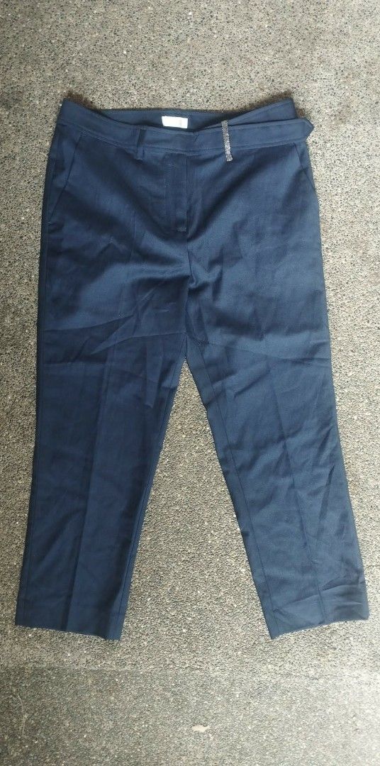 Brunello Cucinelli Navy Virgin Wool Trousers Size US 4 (Category: Other Bottoms) located in Manila. Submitted by beckster_online_luxuryshop (Listing ID 1466447038, Image 1). Description: - Brand: Brunello Cucinelli - Color: Navy - Made in Italy size - Size: USA 4 / EU 36 / Mex 26 - Material: 90% Virgin Wool, 10% Polyester (100% Cupro Lining) - Fit: Classic tailored fit - Features: Side pockets, back welt pocket, and subtle metallic loop detail on