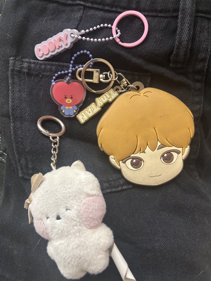 BT21 TinyTAN Cooky TATA keychain mirror plush bundle (Category: Plushies & Soft Toys) located in Manila. Submitted by jobithings (Listing ID 1466402644, Image 1). Description: - Official BT21 and TinyTAN merchandise bundle (BHM/HYBE) - Set includes: Cooky silicone tag, TATA acrylic charm, TinyTAN mirror character keychain, and a white plush character keychain with pink cheeks and a ribbon - Condition: Shows minor signs of handling - Sold as a set