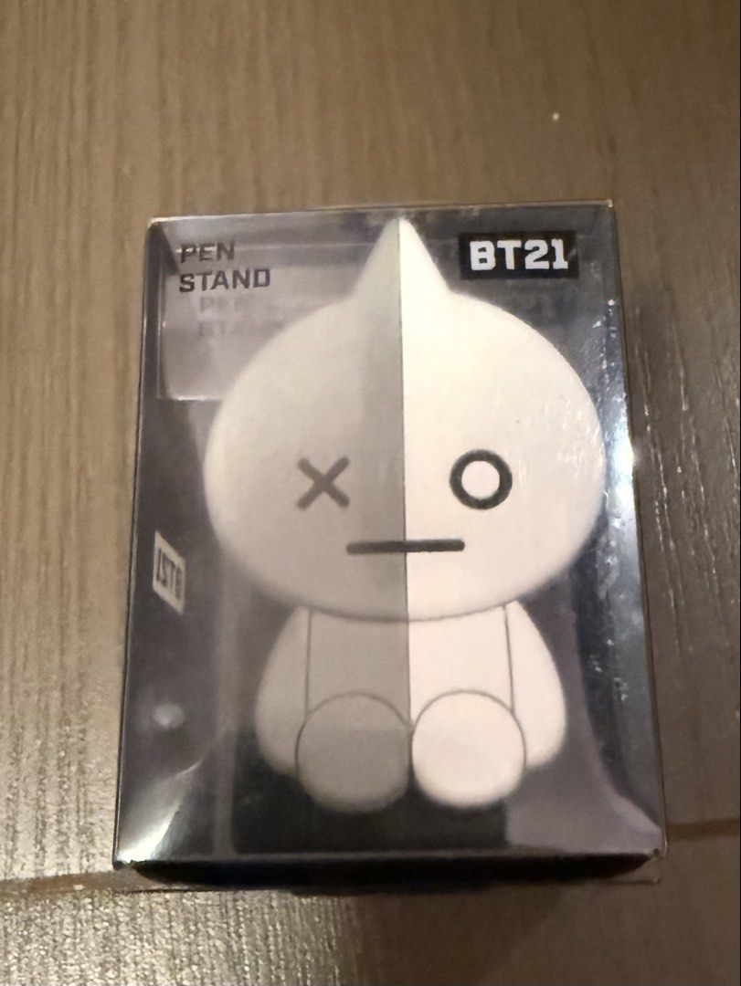 BT21 Van Pen Stand (Category: K-Wave Merchandise) located in Marikina City. Submitted by culose (Listing ID 1466493459, Image 1). Description: - Official Line Friends BT21 merchandise - Adorable sitting figure design in white - Brand new and unopened - Comes in original clear plastic display box - Perfect for desk organization or collection display.
