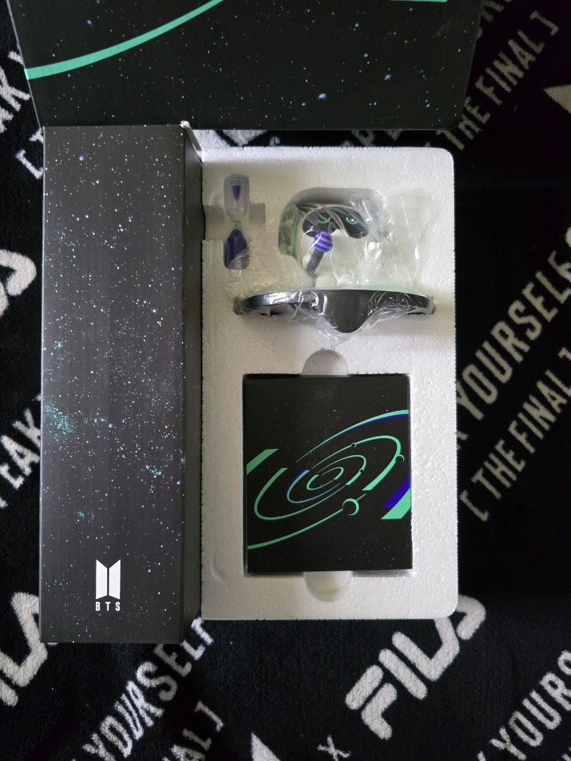 BTS JIN merch box 12 full set (Category: K-Wave Merchandise) located in Davao. Submitted by aikaerika (Listing ID 1466524801, Image 1). Description: Official BTS merchandise set inside a starfield themed box. Includes a patterned block, miniature hourglass, and packaged figurine pieces inside molded white styrofoam packing. Outer sleeve features the BTS logo with green space graphics. Complete set with original packaging intact..