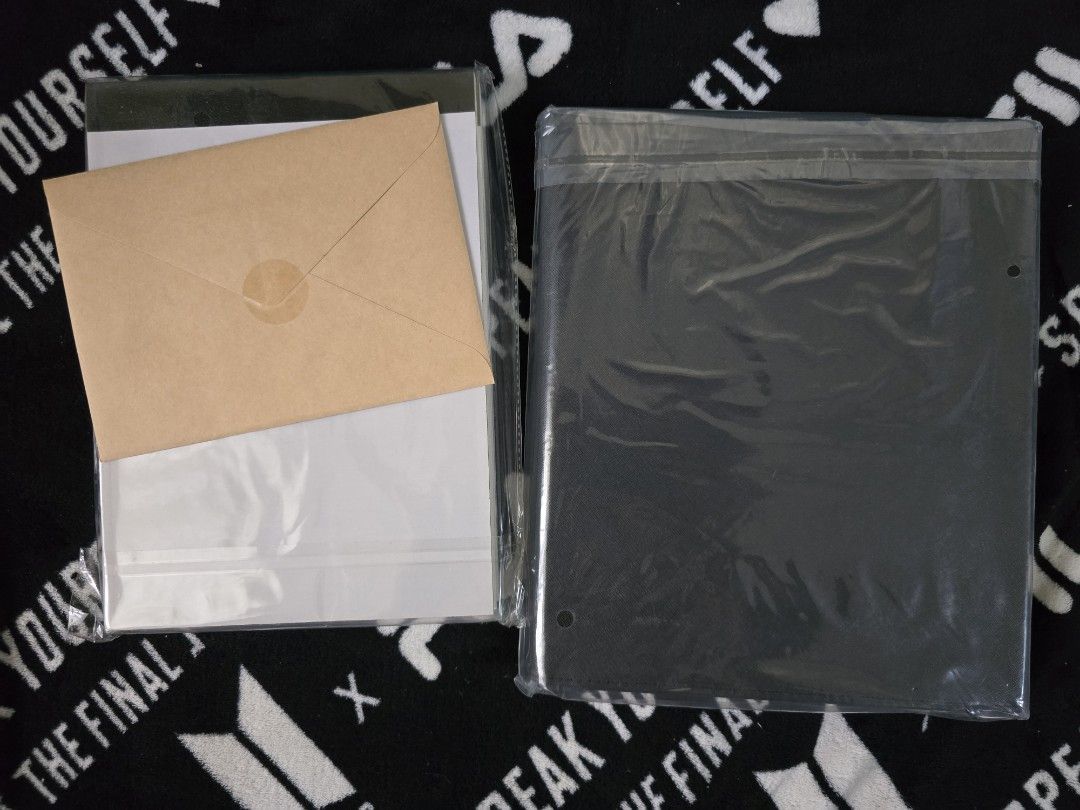 BTS Suga Note Pad and Black Binder Set (Category: K-Wave Merchandise) located in Davao. Submitted by aikaerika (Listing ID 1466525241, Image 2). Description: - 100% Official BTS merchandise set - Includes: Lined notepad with purple BTS logo, brown envelope featuring Suga's handwritten signature, and a dark black binder - Condition: Brand new, unopened, and unused - Packaging: Still sealed in original clear plastic - Perfect addition to your BTS c