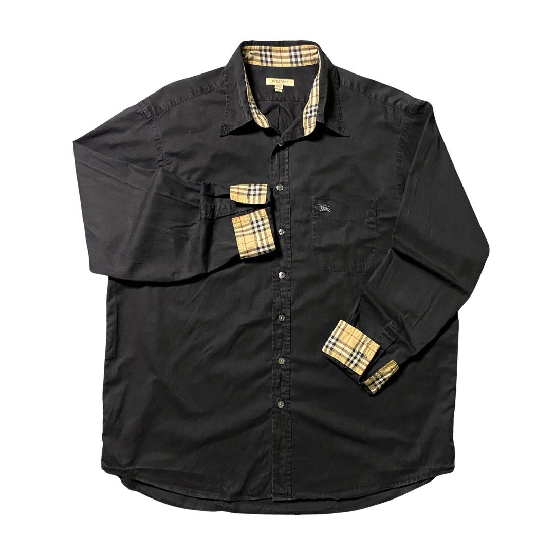 Burberry Black Button Down Polo Longsleeves ( Like New ) (Category: Formal Shirts) located in Manila. Submitted by streetplug (Listing ID 1466528087, Image 1). Description: issues | flaws : none ☑️ measurement : 22 x 29 color rate : 10 / 10 🎨 location : las piñas 📍 jnt | lbc | lalamove meetup around las piñas area ‼️.