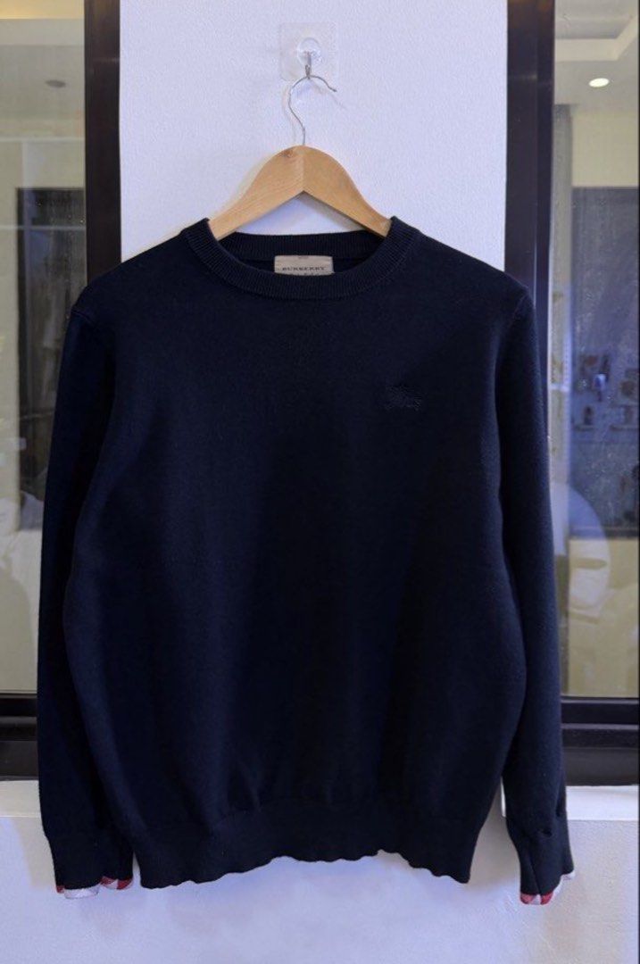 Burberry Black Crewneck Sweater (Category: Coats, Jackets and Outerwear) located in Paranaque City. Submitted by preluxeshop_ph (Listing ID 1457685445, Image 2). Description: Burberry Black Crewneck Sweater - Made in Scotland - Iconic embroidered Burberry Equestrian Knight logo on chest - Versatile for dressing up or down - Perfect for layering - Timeless wardrobe essential 🔥CHECK OUT MY PROFILE FOR 100+ OTHER HIGH-END CURATED STREETWEAR, COATS 