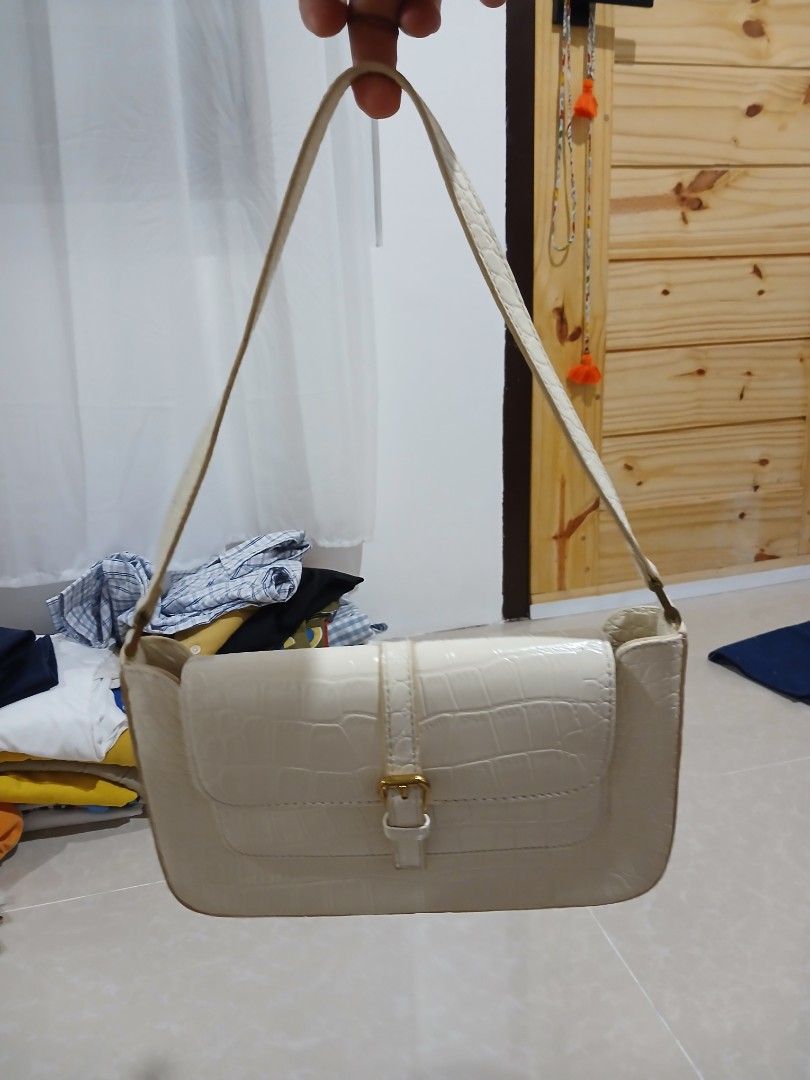 By Far White Crocodile Embossed Shoulder Bag (Category: Shoulder Bags) located in Quezon City. Submitted by mcenon35 (Listing ID 1466478534, Image 3). Description: - Brand: By Far - Origin: Made in Spain - Material/Design: White croc embossed leather with structured rectangular shape - Hardware: Gold-tone buckle detail - Compartment: Front flap pocket and clean white interior lining with embossed brand patch - Strap: Single shoulder strap - Condi