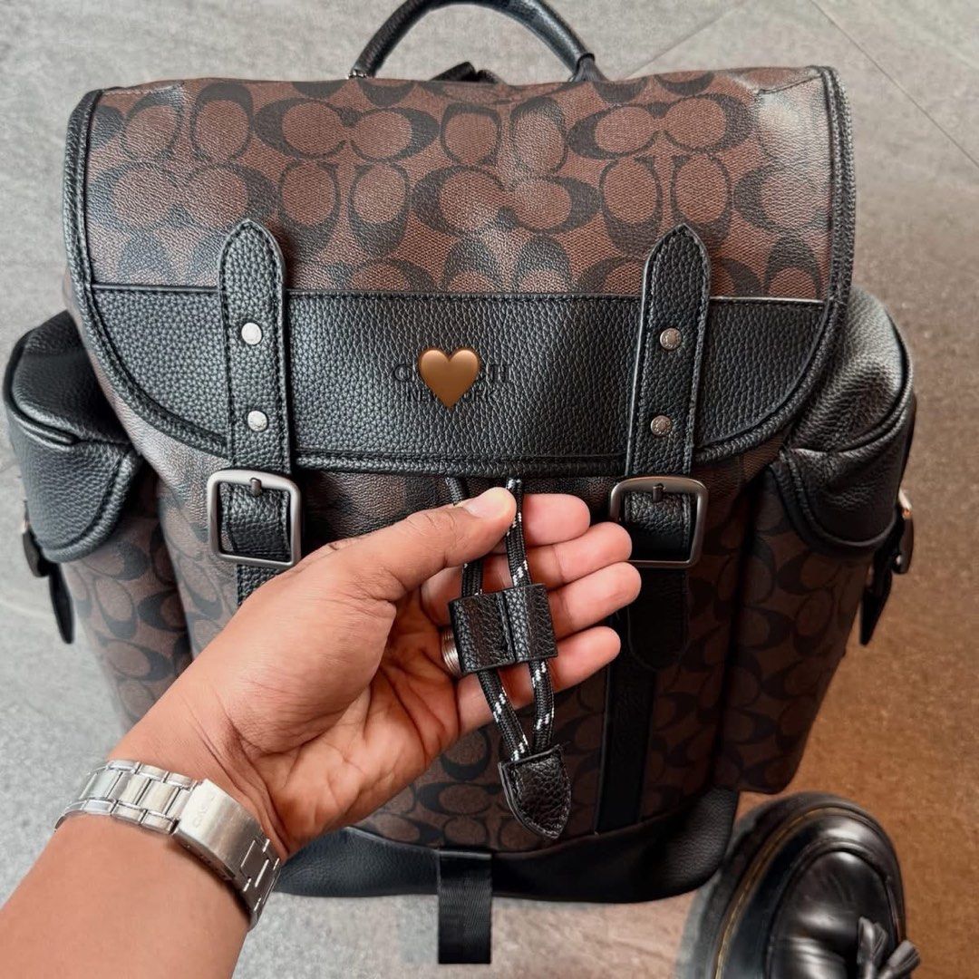 C0@ch Leather Bagpack (Category: Backpacks) located in Manila. Submitted by hatline_co. (Listing ID 1466348990, Image 3). Description: Leather Backpack Wide & Multiple Copartments Double lock Double water bottle pocket Adjustable straps Comes with Dust bag & Paper bag SALE!! .