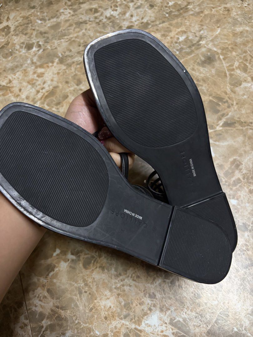 Calliope Black Strap Sandals (Category: Flats & Sandals) located in Bacoor. Submitted by jblns (Listing ID 1466441217, Image 2). Description: - Brand: Calliope - Color: Black - Size: 40 - Style: Flat sandals with trendy square toes and slender straps - Details: Long straps that wrap around the legs Brand new, never used.